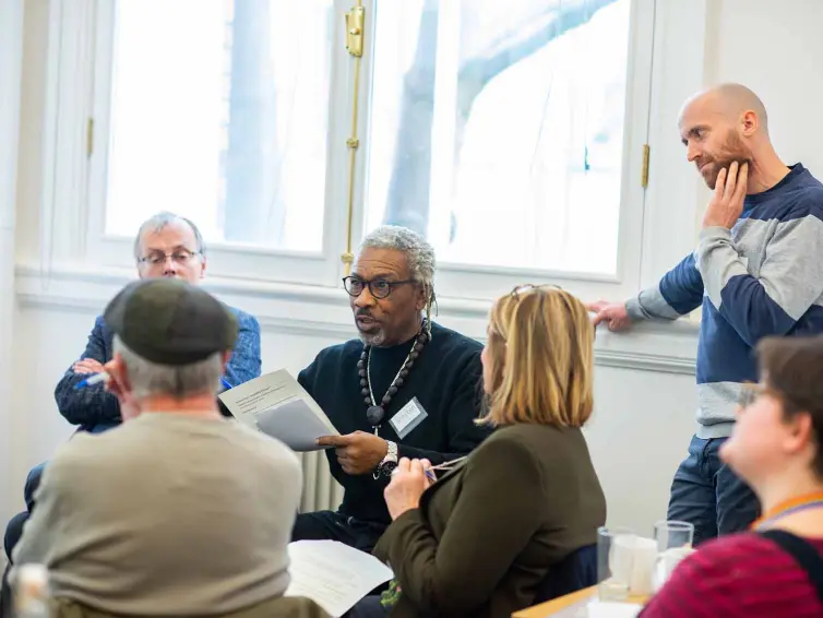 Person talking in a group of people.