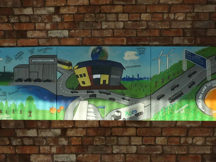 Woodhouse Park youth group artwork of a cartoon city landscape.