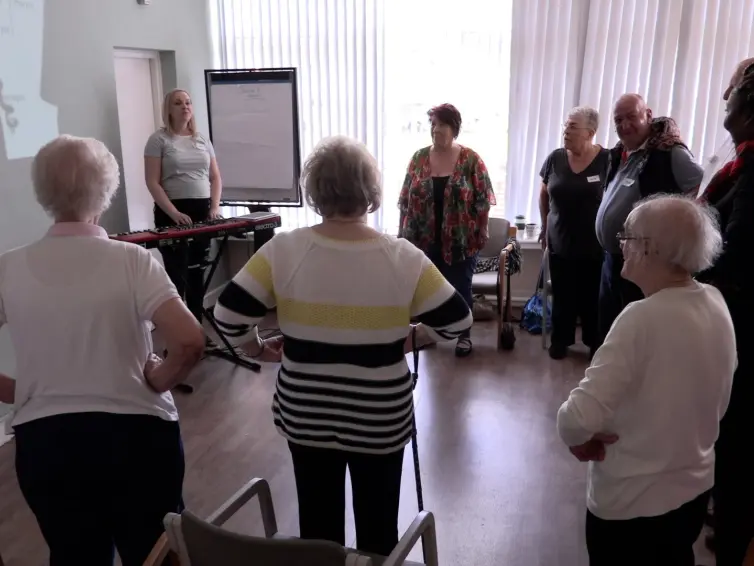 Group of people singing.