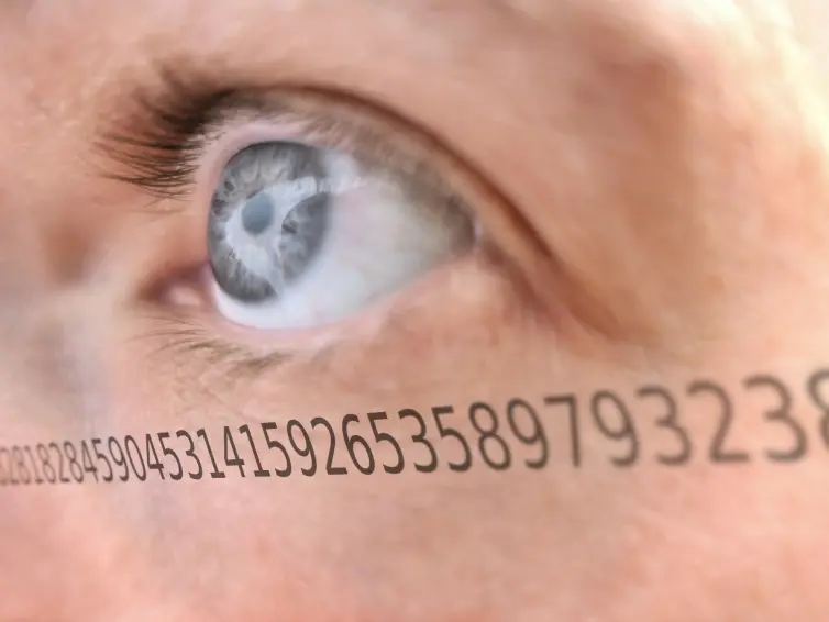 A close up of an open eye with numbers justaxposed onto it.