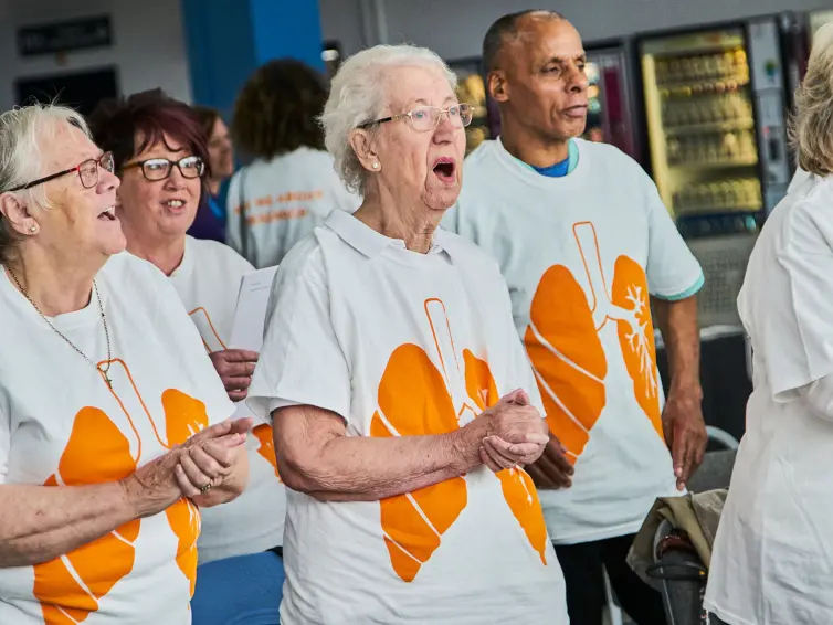 A group of people singing.